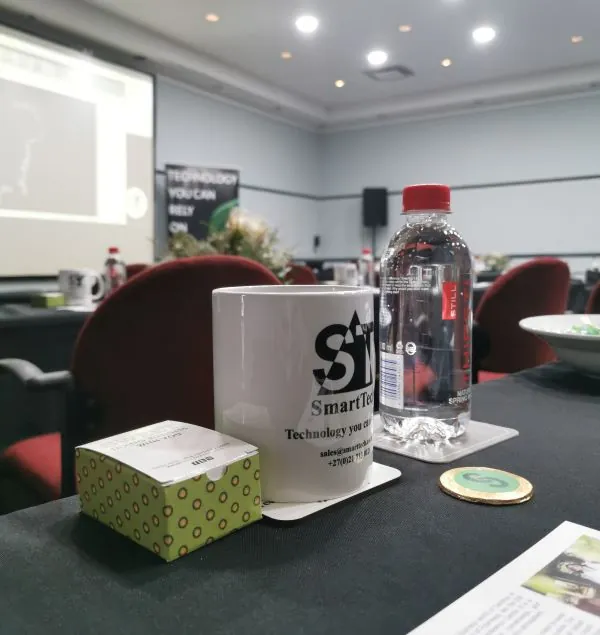 Photo of SmartTech mug and other items on the desks at the STAPIL CAD Pre-launch
